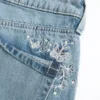 Blugi baggy cu talie joasă, spălare medie și imprimeu fluture Blugi baggy cu talie joasă, spălare medie și imprimeu fluture