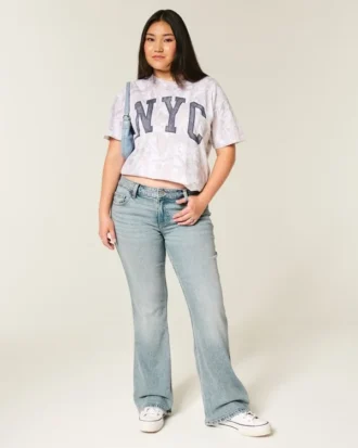 Blugi bootcut cu talie joasă și spălare deschisă