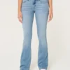 Blugi bootcut cu talie joasă și spălare deschisă Blugi bootcut cu talie joasă și spălare deschisă