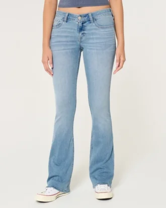 Blugi bootcut cu talie joasă și spălare deschisă