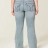 Blugi bootcut cu talie joasă și spălare deschisă Blugi bootcut cu talie joasă și spălare deschisă