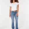 Blugi bootcut cu talie joasă și spălare medie Blugi bootcut cu talie joasă și spălare medie