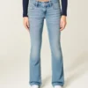 Blugi bootcut cu talie joasă și spălare medie Blugi bootcut cu talie joasă și spălare medie