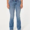 Blugi bootcut cu talie joasă și spălare medie Blugi bootcut cu talie joasă și spălare medie