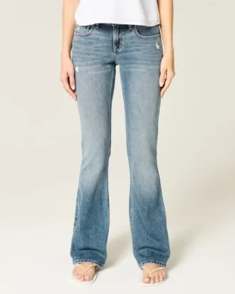 Blugi bootcut cu talie joasă, spălați mediu, cu aspect uzat
