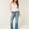 Blugi bootcut cu talie joasă, spălați mediu și rupți Blugi bootcut cu talie joasă, spălați mediu și rupți