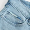 Blugi bootcut cu talie joasă, spălați ușor, cu broderie și rupturi Blugi bootcut cu talie joasă, spălați ușor, cu broderie și rupturi