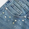 Blugi bootcut cu talie joasă, spălare medie, cu ținte Blugi bootcut cu talie joasă, spălare medie, cu ținte