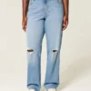 Blugi dad jeans cu talie înaltă, croi curbat, spălați mediu, cu rupturi Blugi dad jeans cu talie înaltă, croi curbat, spălați mediu, cu rupturi