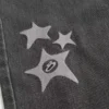 Blugi largi cu imprimeu Black Star spălați Blugi largi cu imprimeu Black Star spălați