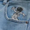 Blugi super largi cu imprimeu astronaut, spălați ușor Blugi super largi cu imprimeu astronaut, spălați ușor