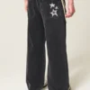 Blugi super largi cu imprimeu negru spălat Blugi super largi cu imprimeu negru spălat