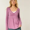 Bluză babydoll cu mâneci lungi și bust strâns Bluză babydoll cu mâneci lungi și bust strâns