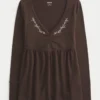 Bluză babydoll cu mâneci lungi și bust strâns Bluză babydoll cu mâneci lungi și bust strâns