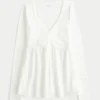 Bluză babydoll cu mâneci lungi și bust strâns Bluză babydoll cu mâneci lungi și bust strâns