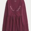 Bluză babydoll cu mâneci lungi și bust strâns Bluză babydoll cu mâneci lungi și bust strâns
