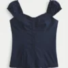 Bluză cu mâneci scurte din poplin elastic Bluză cu mâneci scurte din poplin elastic