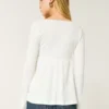 Bluză lungă cu mâneci lungi și model pointelle Bluză lungă cu mâneci lungi și model pointelle