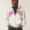 Boxy Hanorac cu glugă și fermoar cu grafică Ohio State University Buckeyes Boxy Hanorac cu glugă și fermoar cu grafică Ohio State University Buckeyes
