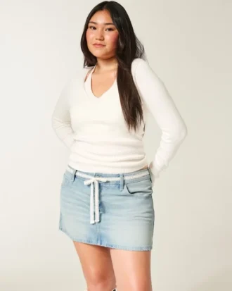 Fustă mini din denim cu talie joasă și dantelă