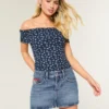 Fustă mini din denim cu talie joasă, spălare medie și broderie cu steag Fustă mini din denim cu talie joasă, spălare medie și broderie cu steag