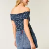 Fustă mini din denim cu talie joasă, spălare medie și broderie cu steag Fustă mini din denim cu talie joasă, spălare medie și broderie cu steag