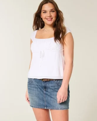 Fustă-pantalon mini din denim brodat, cu talie joasă