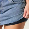 Fustă-pantalon mini din denim cu talie joasă și spălare medie Fustă-pantalon mini din denim cu talie joasă și spălare medie