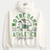 Hanorac cu glugă și fermoar, cu imprimeu Fighting Irish al Universității Notre Dame Hanorac cu glugă și fermoar, cu imprimeu Fighting Irish al Universității Notre Dame