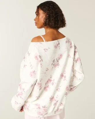 Hanorac oversized cu umeri decupați și model floral cu fundă