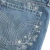 Mini pantaloni scurți din denim cu talie ultra joasă, spălare medie și broderie florală Mini pantaloni scurți din denim cu talie ultra joasă, spălare medie și broderie florală