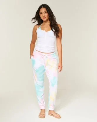 Pantaloni de jogging din bumbac cu efect de spălare și logo grafic