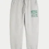 Pantaloni de jogging largi din fleece cu imprimeu Michigan State University Spartans Pantaloni de jogging largi din fleece cu imprimeu Michigan State University Spartans