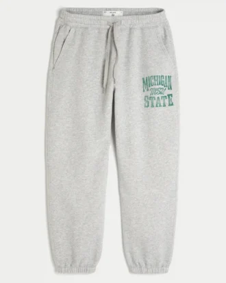 Pantaloni de jogging largi din fleece cu imprimeu Michigan State University Spartans Pantaloni de jogging largi din fleece cu imprimeu Michigan State University Spartans