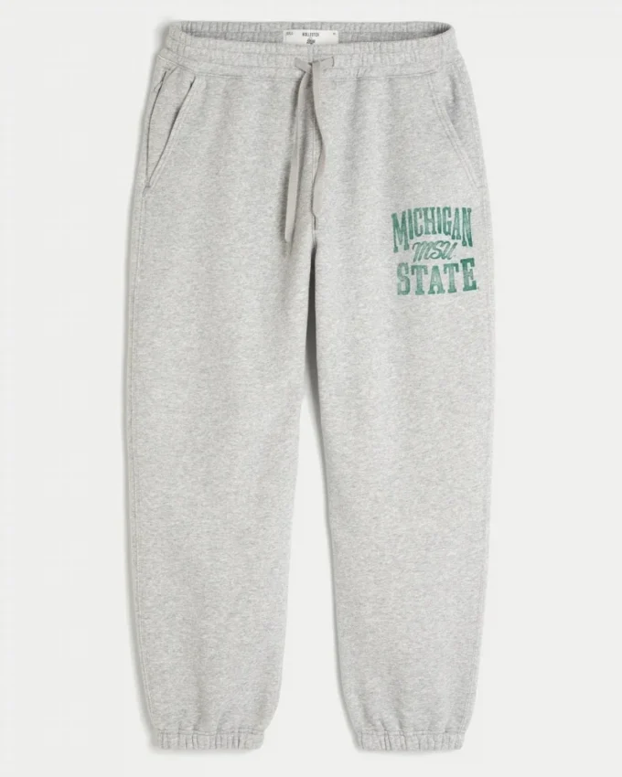 Pantaloni de jogging largi din fleece cu imprimeu Michigan State University Spartans Pantaloni de jogging largi din fleece cu imprimeu Michigan State University Spartans