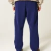 Pantaloni de jogging largi din fleece cu imprimeu Wolverines de la Universitatea din Michigan Pantaloni de jogging largi din fleece cu imprimeu Wolverines de la Universitatea din Michigan