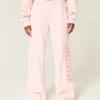 Pantaloni de trening cu picior larg și logo Pantaloni de trening cu picior larg și logo