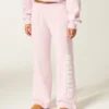 Pantaloni de trening cu picior larg și logo grafic Pantaloni de trening cu picior larg și logo grafic