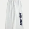 Pantaloni de trening cu picior larg și logo grafic Pantaloni de trening cu picior larg și logo grafic