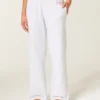 Pantaloni de trening cu picior larg și logo strălucitor Pantaloni de trening cu picior larg și logo strălucitor