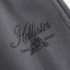 Pantaloni de trening cu picior larg și logo strălucitor
