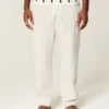 Pantaloni de trening largi cu broderie pe spate Pantaloni de trening largi cu broderie pe spate