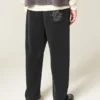 Pantaloni de trening largi cu broderie Spider Pantaloni de trening largi cu broderie Spider