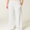 Pantaloni de trening largi cu imprimeu arc Pantaloni de trening largi cu imprimeu arc