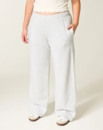 Pantaloni de trening largi cu imprimeu arc Pantaloni de trening largi cu imprimeu arc