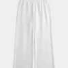 Pantaloni de trening largi cu imprimeu arc Pantaloni de trening largi cu imprimeu arc