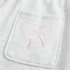 Pantaloni de trening largi cu imprimeu arc Pantaloni de trening largi cu imprimeu arc