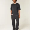 Pantaloni de trening largi cu imprimeu șarpe Pantaloni de trening largi cu imprimeu șarpe