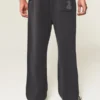 Pantaloni de trening largi cu imprimeu șarpe Pantaloni de trening largi cu imprimeu șarpe