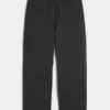 Pantaloni de trening largi cu imprimeu șarpe Pantaloni de trening largi cu imprimeu șarpe